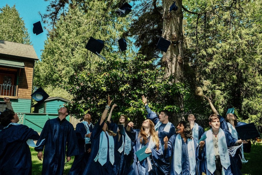 Class of 2023 toss their caps after graduating