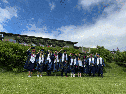 The Class of 2024 toss their caps in the air - Mark Gsellman photo