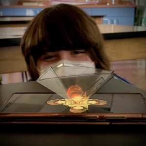 9th-grade student doing hologram lab in physics class