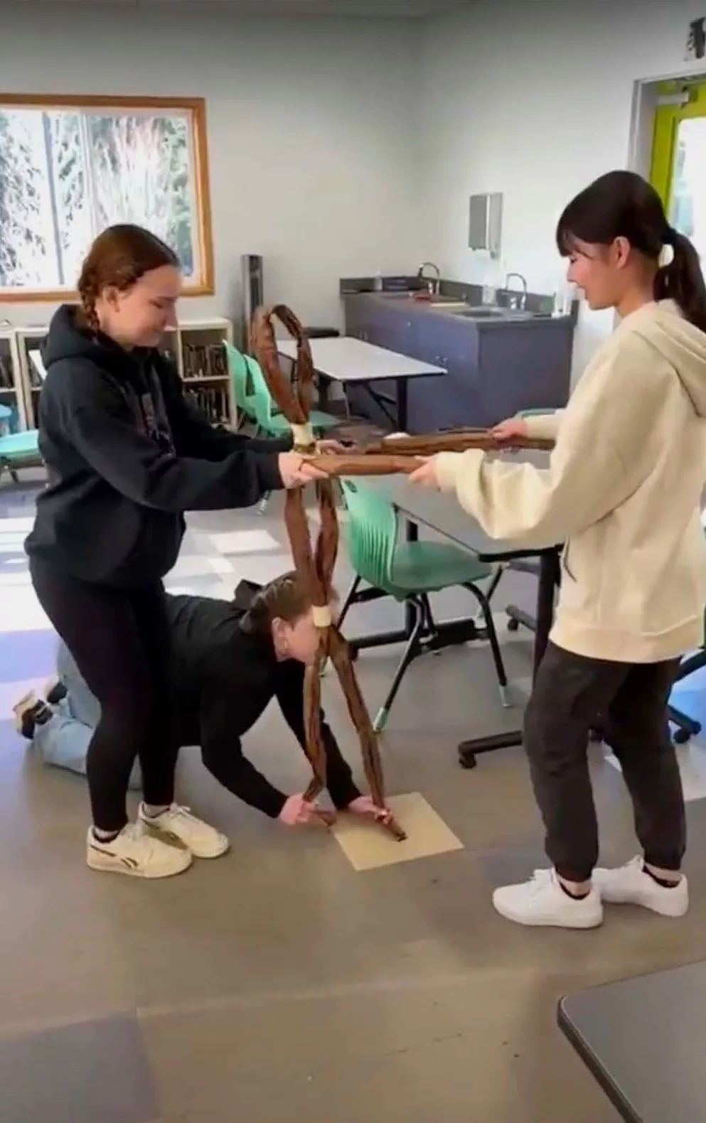 10th Grade Theatre student dancing with her group's puppet