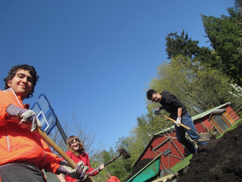 WSA students help with cleaning up a community garden at a local park