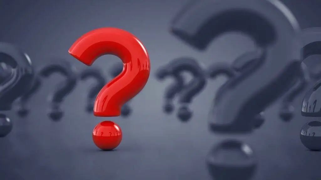 Red question mark standing out on dark background - Britannica ImageQuest