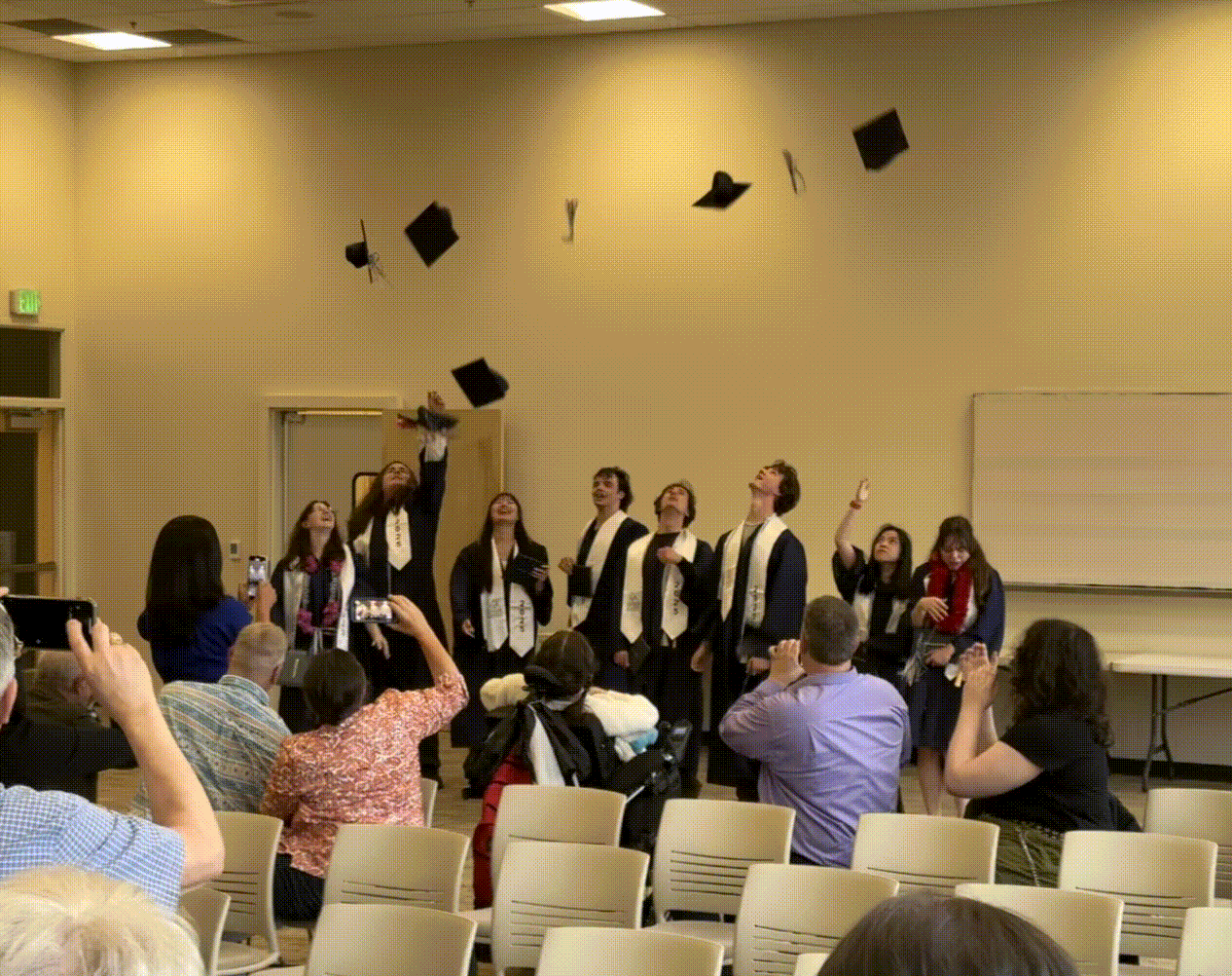 The Class of 2025 toss their cap - Paul Burback photo