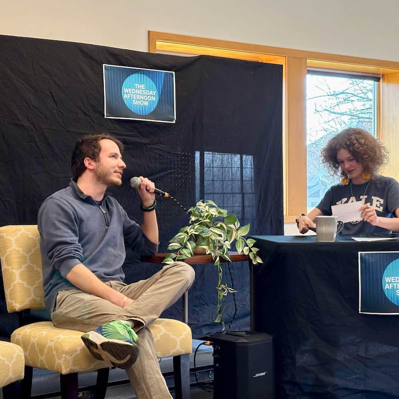 Talk show guest Luca Brambilla being interviewed by host Annie Strum