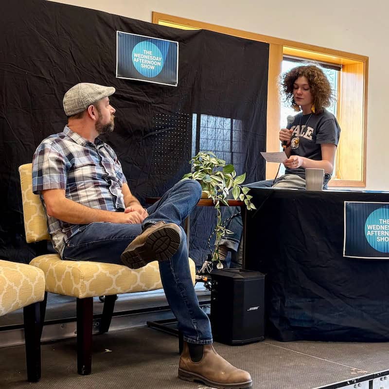 Talk show guest Paul Burback being interviewed by host Annie Strum