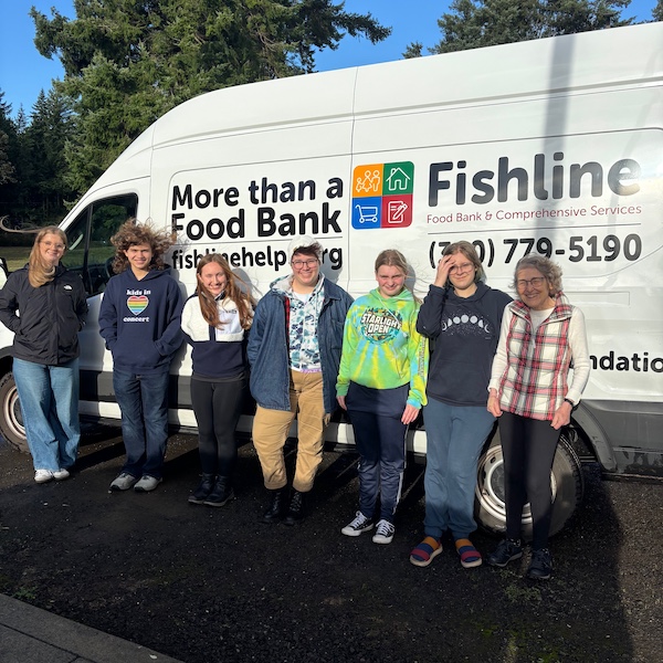 WSA's GSA Club with the Kitsap Fishhline truck collecting the donations from their food drive
