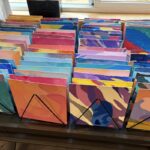 Individual tiles for the Mount St. Hellens mural, each painted by a different student or staff member