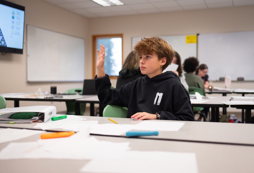 MS_boy_raises_hand_in_class_Nov-04-2025RS Middle School boy raises his hand in Humanities class