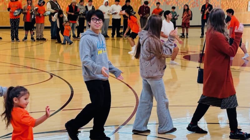 Autumn_Yeva_Ms_Thalia_dancing_with_CKA_Sept-28-2026 West Sound Academy students and staff dance to the drumming and singing of the Chief Kitsap Academy students