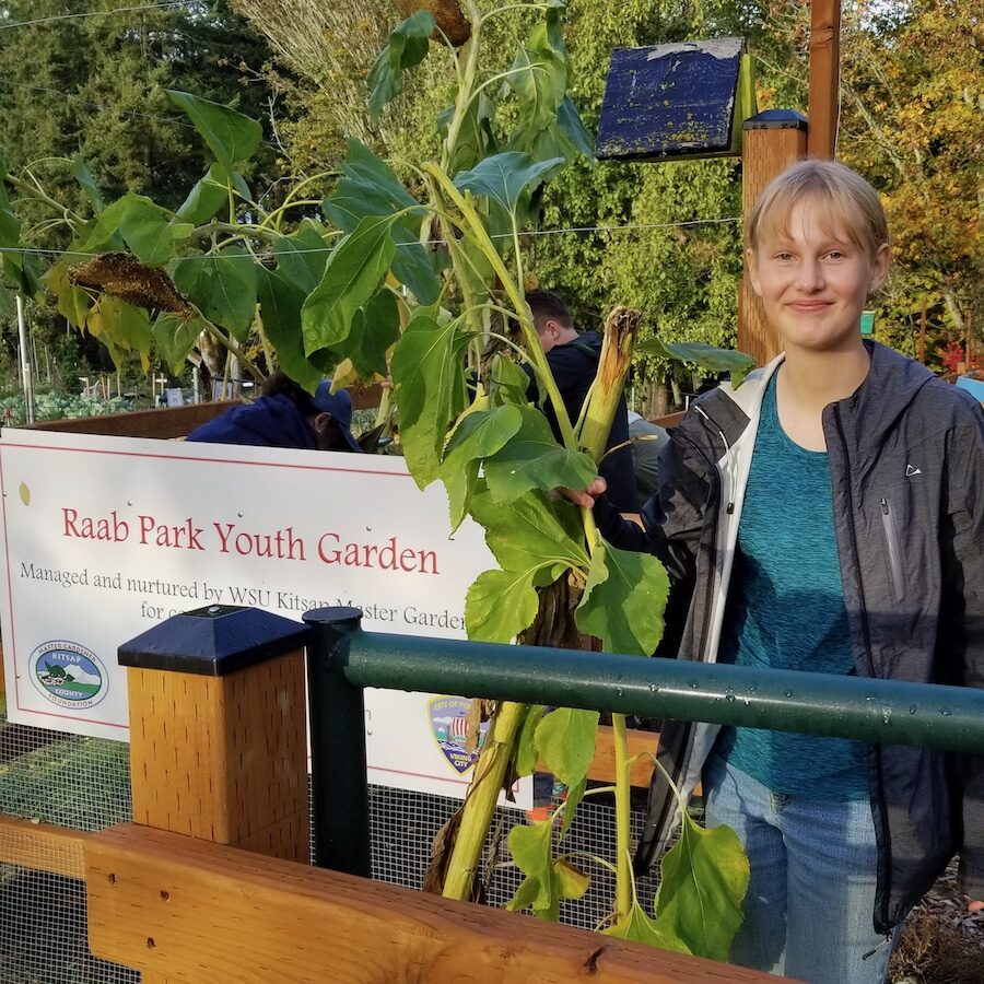 Middle School girl working at Raab Park community garden